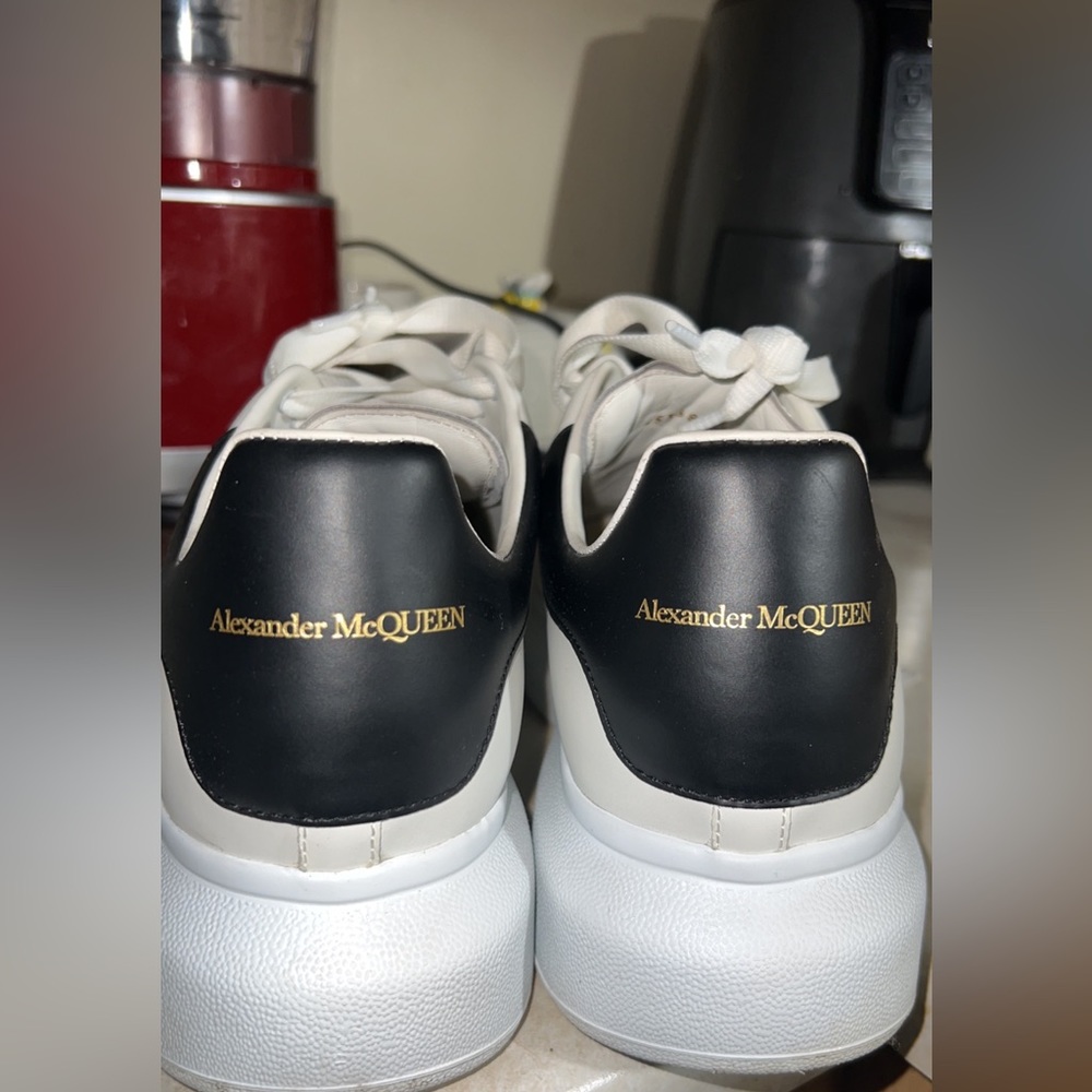 Alexander McQueen White smooth shiny classic calf leather lace up sneaker.